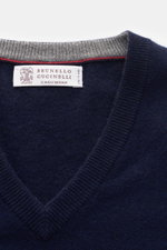 Close-up top-down view of the navy Brunello Cucinelli Cashmere V-neck jumper showing fine knit, flexible ribbed bands, and narrow contrasting borders.

Description: 
<p>Luxurious cashmere combined with a classic design: This V-neck jumper with narrow cont