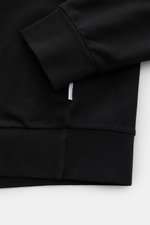 Schwarzer 04651/ A trip in a bag Kapuzenpullover 'IF Hoodie' im Detail, Nahaufnahme von Ärmel und Bund mit weichem, elastischem Jersey.