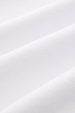 Close-up front view of soft white terrycloth fabric, showcasing the texture of the 04651/ A trip in a bag Terry hooded jumper 'Terry' white.

Description: <p>Comfort and coolness with summery nonchalance: The hooded jumper 'Terry' by 04651/ A TRIP IN A BA