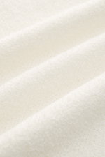 Close-up front view of the off-white 04651/ A trip in a bag Hooded jumper 'Knit Terry Hoodie' showing fine bouclé texture. 

<p>Distinctive terry look: The casual hooded jumper 'Knit Terry Hoodie' by 04651/ A TRIP IN A BAG gets its comfortable feel from i