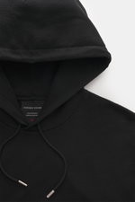 Close-up front view of the Canada Goose Hoodie 'Loon' black, showing hood with drawstring and label inside collar.

<p>Urban style meets comfort – the 'Loon' hoodie by CANADA GOOSE combines pleasant wearing comfort with a sporty-elegant design.</p>
<ul>
<