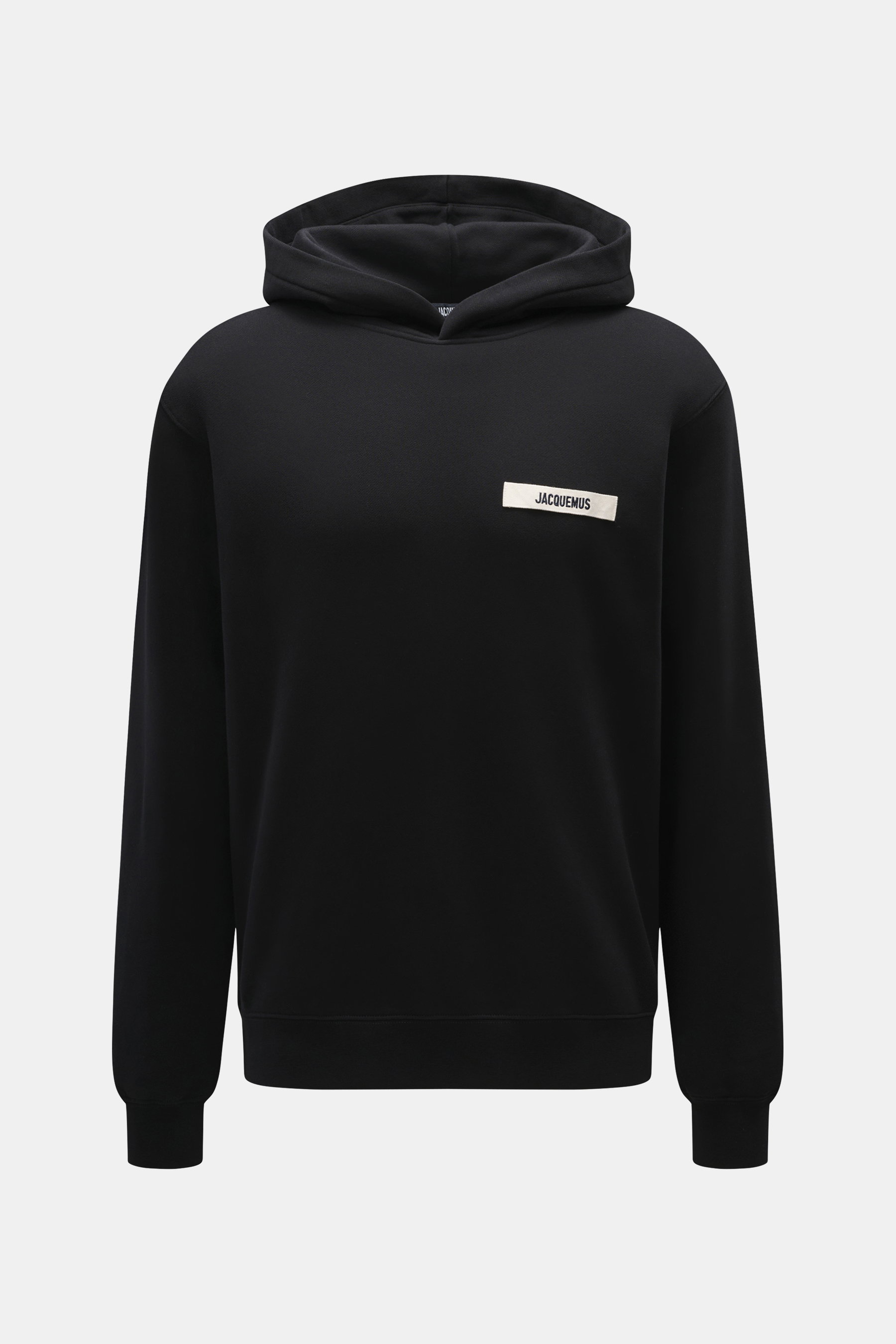 Front view of Jacquemus Hoodie 'Gros Grain' black, pure cotton, heavy quality, soft inside, distinctive overlock seams, regular fit, practical hood, grosgrain with logo stitching on chest, comfortable ribbed cuffs.