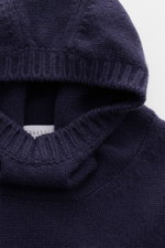Close-up front view of the hood and high shawl collar of the 04651/ A trip in a bag Hooded jumper dark blue, showcasing its medium-fine knit texture and wide ribbed bands. <p>Provides reliable warmth: This hooded jumper from 04651/ A TRIP IN A BAG, with i