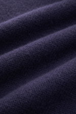 Close-up front view of dark blue 04651/ A trip in a bag Hooded jumper fabric showing soft, medium-fine knit texture.

<p>Provides reliable warmth: This hooded jumper from 04651/ A TRIP IN A BAG, with its turtleneck and hood design, is a comfortable and fa