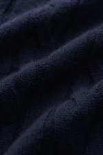 Close-up of navy cable knit fabric showing soft texture and fine stitches of the von Braun Cashmere turtleneck jumper navy, photographed from a high angle.

Description: <p>Comfortable through the winter: Soft cashmere from Inner Mongolia knitted into a c
