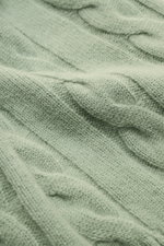 Close-up front view of the von Braun Cashmere turtleneck jumper grey-green showing soft pure cashmere with classic cable knit pattern.

<p>Comfortable through the winter: Soft cashmere from Inner Mongolia knitted into a classic cable knit pattern makes 
