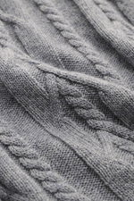 Close-up view of the grey mottled von Braun Cashmere turtleneck jumper showing detailed cable knit patterns and soft texture.

Description:  
<p>Elegant everyday piece: Premium cashmere from Inner Mongolia forms the basis for this luxurious VON BRAUN turt