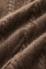 Close-up angled view of von Braun Cashmere turtleneck jumper brown mottled, showing premium Inner Mongolia cashmere with a timeless cable knit pattern, slim fit, medium-fine knit, close-fitting turtleneck, flexible ribbed bands, and very soft feel, an ele