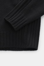 Belstaff Rollkragenpullover 'Watch' schwarz, Detailaufnahme von Ärmel und Bund, reine Wolle, weicher Griff, grobes Strickbild, Rippstrick-Elemente, Slim Fit, Rollkragen, BELSTAFF-Weblabel auf der Brust, flexible Rippbündchen.