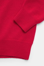 Close-up top view of Malo Cashmere Turtleneck Sweater red sleeve and cuff showing pure cashmere, soft touch, medium-fine knit, slim fit, ribbed cuffs, and fitted turtleneck.