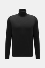 Malo Rollkragenpullover schwarz aus feiner Schurwolle, Slim Fit mit anliegendem Rollkragen und Rippbündchen, frontal fotografiert.