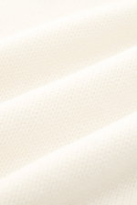 Close-up front view of Fioroni Cashmere Rundhalspullover creme showcasing pure cashmere fabric with a very soft touch, medium-fine knit, slim fit, turtleneck, and flexible ribbed cuffs, embodying sovereign elegance in its most luxurious form.