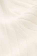 Close-up view of the Fioroni Cashmere Turtleneck Sweater Cream showcasing its pure cashmere, soft touch, cable knit pattern, fine knit texture, slim fit, turtleneck, and flexible ribbed cuffs.