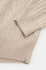Close-up top-down view of Fioroni Cashmere Turtleneck Sweater beige showing pure cashmere soft texture, cable knit, ribbed cuffs, slim fit.