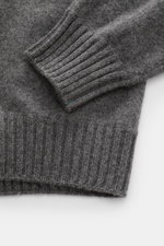 Close-up top-down view of Fioroni Cashmere Turtleneck Sweater 'Duvet' dark grey mélange showing fine knit, ribbed turtleneck, flexible cuffs, pure cashmere, soft feel, slim fit.