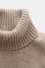 Close-up front view of Fioroni Cashmere Turtleneck Sweater 'Duvet' taupe mélange showing ribbed turtleneck with fine knit pattern, pure cashmere, very soft feel, slim fit, and flexible ribbed cuffs. Luxurious warmth with an Italian touch, made using tradi