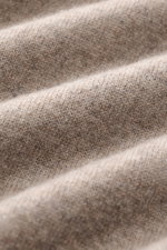 Close-up front view of the Fioroni Cashmere Turtleneck Sweater 'Duvet' taupe mélange showing fine knit pattern and soft texture, pure cashmere, slim fit with ribbed turtleneck and flexible ribbed cuffs, crafted using traditional techniques and refined wit