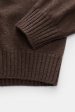 Fioroni Cashmere Turtleneck Sweater 'Duvet' dark brown mélange shown close-up from above, highlighting ribbed cuffs and hem, pure cashmere, very soft feel, fine knit pattern, slim fit, ribbed turtleneck, and flexible ribbed cuffs.