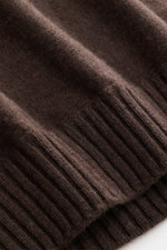 Close-up front view of the ribbed cuff and fine knit pattern of the Fioroni Cashmere Turtleneck Sweater 'Duvet' dark brown mélange, showcasing its pure cashmere, very soft feel, slim fit, ribbed turtleneck, and flexible ribbed cuffs. Luxurious warmth with