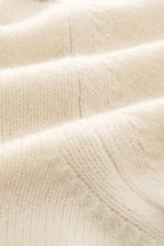 Close-up front view of cream-colored B.F. Knitwear Cashmere Turtleneck Sweater showing soft, medium-fine knit texture.

Description: <p>Autumnal cashmere by the knitting expert B.F. KNITWEAR: This softly knitted turtleneck sweater is the perfect addition 