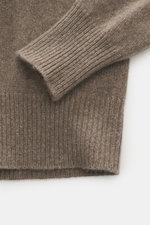 Close-up, top-down view of B.F. Knitwear Cashmere Turtleneck Sweater taupe melange showing soft, pure cashmere fabric, medium-fine knit, slim fit, fitted turtleneck, and elastic rib-knit cuffs. Autumnal cashmere by B.F. KNITWEAR: This softly knitted turtl