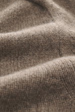 Close-up perspective of the soft, medium-fine knit pattern in the taupe melange B.F. Knitwear Cashmere Turtleneck Sweater.

Description: <p>Autumnal cashmere by the knitting expert B.F. KNITWEAR: This softly knitted turtleneck sweater is the perfect addit