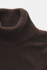 Close-up top-down view of B.F. Knitwear Cashmere Turtleneck Sweater dark brown showing fitted turtleneck, soft medium-fine knit, and rib-knit cuffs.