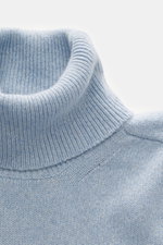 Close-up front view of B.F. Knitwear Cashmere Turtleneck Sweater light blue melange showing fitted turtleneck and medium-fine knit.