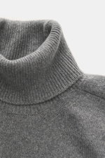 Close-up front view of B.F. Knitwear Cashmere Turtleneck Sweater grey melange showing fitted turtleneck and rib-knit cuffs, pure cashmere, soft touch, medium-fine knit, Slim Fit, made in Italy, perfect for autumn.