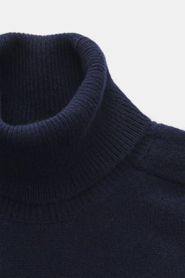 Close-up top-down view of B.F. Knitwear Cashmere Turtleneck Sweater navy, a pure cashmere, soft-touch, slim fit turtleneck with medium-fine knit and elastic cuffs.