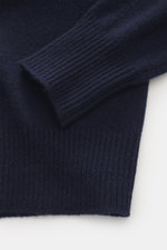 Close-up from above of B.F. Knitwear Cashmere Turtleneck Sweater navy showing soft, pure cashmere fabric, slim fit, medium-fine knit, and elastic rib-knit cuffs.