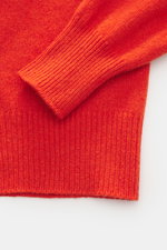 Close-up front view of the B.F. Knitwear Cashmere Turtleneck Sweater orange showing soft pure cashmere, medium-fine knit, slim fit, fitted turtleneck, and elastic rib-knit cuffs. Autumnal cashmere by the knitting expert B.F. KNITWEAR: This softly knitted 