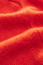 Close-up front view of the orange B.F. Knitwear Cashmere Turtleneck Sweater showing its medium-fine knit pattern and soft texture.

Description: <p>Autumnal cashmere by the knitting expert B.F. KNITWEAR: This softly knitted turtleneck sweater is the perfe