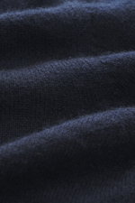 Close-up front view of Aida Barni Cashmere turtleneck sweater navy, showing pure cashmere, soft feel, fine knit, slim fit, close turtleneck, ribbed cuffs.