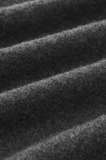 Close-up texture of Aida Barni Cashmere turtleneck sweater dark grey melange, photographed from a detailed side angle, showcasing pure cashmere’s soft feel and fine knit pattern.

<p>Italian knitwear by AIDA BARNI: With a timeless look and finest cashmere