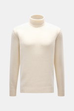 Della Ciana Rollkragenpullover creme, frontal fotografiert, Slim Fit, mittelgrobes Strickbild, Mix aus Wolle und Cashmere, weicher Griff, Rollkragen, komfortable Rippbündchen.