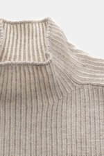 Brunello Cucinelli Cashmere Mockneck Sweater beige shown close-up from above, patent knit of pure cashmere, slim fit, smooth feel, ribbed cuffs.