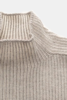 Brunello Cucinelli Cashmere Mockneck Sweater beige shown close-up from above, patent knit of pure cashmere, slim fit, smooth feel, ribbed cuffs.