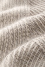 Close-up front view of the beige Brunello Cucinelli Cashmere Mockneck Sweater showing patent knit, medium-fine pattern, and soft texture.