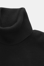 Ami Paris Merino Turtle Neck Sweater Black shown from a close-up frontal perspective, featuring a narrow turtle neck, fine knit pattern, ribbed cuffs, and logo stitching, made of pure merino wool with a soft touch, regular fit, perfect for office and leis