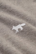 Close-up front view of Maison Kitsuné Turtleneck Sweater 'Profile Fox' taupe melange showing fine wool knit and white fox stitching.

Description: <p>Cool essential by MAISON KITSUNÉ: With the typical fox stitching on the chest, this lightweight turtlenec