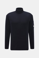 Front view of C.P. Company Turtleneck sweater navy, knit from virgin wool and microfiber, soft feel, medium-fine knit, rib stitch, slim fit, close turtleneck, zippered upper arm pocket, lens detail, flexible rib cuffs.