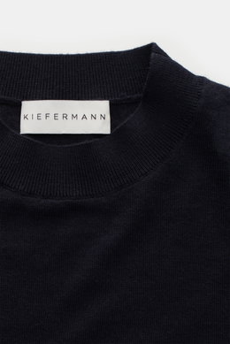 Close-up top-down view of the Kiefermann Merino Fine Knit Sweater 'Malt' navy, showing pure merino wool, super soft touch, very fine knit pattern, slim fit, high crew neckline, and elastic sleeve cuffs.