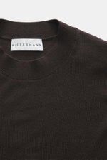 Close-up front view of the Kiefermann Merino Fine Knit Sweater 'Malt' dark brown featuring pure merino wool, super soft touch, very fine knit pattern, slim fit, high crew neckline, and elastic sleeve cuffs.