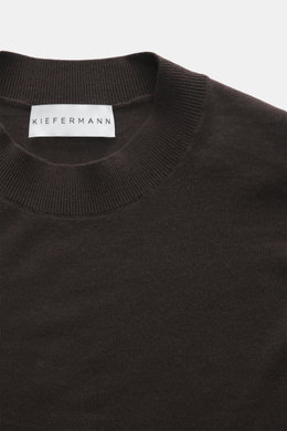 Close-up front view of the Kiefermann Merino Fine Knit Sweater 'Malt' dark brown featuring pure merino wool, super soft touch, very fine knit pattern, slim fit, high crew neckline, and elastic sleeve cuffs.