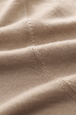Close-up front view of Kiefermann Merino Fine Knit Sweater 'Malt' light brown showing pure merino wool, super soft touch, very fine knit pattern, slim fit, high crew neckline, elastic sleeve cuffs.