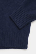 Close-up front view of the navy Bruno Manetti Cashmere turtleneck jumper showing medium-fine knit and ribbed bands.