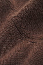Close-up, angled top-down view of the Bruno Manetti Cashmere turtleneck jumper dark brown, showing its soft, medium-fine knit texture and ribbed bands. 

<p>A timeless winter essential: This elegant turtleneck jumper by BRUNO MANETTI keeps you warm with i