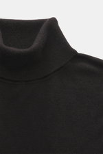 Close-up front view of the FTC Fine knit turtleneck sweater dark brown, showing its fitted turtleneck, very fine knit pattern, and soft touch blend of Fair-Trade Cashmere and Lyocell (SeaCell), with comfortable ribbed cuffs and slim fit.