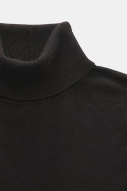 Close-up front view of the FTC Fine knit turtleneck sweater dark brown, showing its fitted turtleneck, very fine knit pattern, and soft touch blend of Fair-Trade Cashmere and Lyocell (SeaCell), with comfortable ribbed cuffs and slim fit.